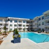 Spacious pool deck and community pool at The Catherine
